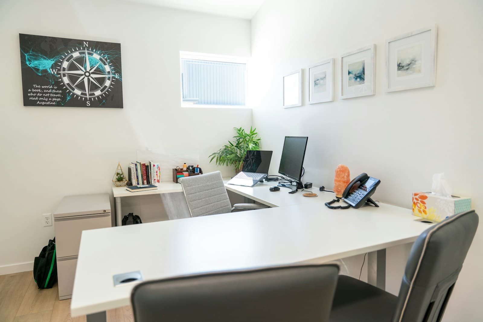 Modern office workspace with dual monitors and organized desk